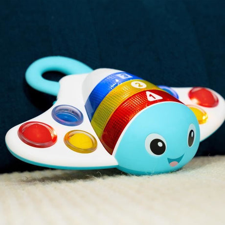 BABY EINSTEIN  RAIE - Jouet intéractif d'éveil sensoriel, musical, apprentissage des couleurs, cadeau bébé  6M+