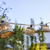Guirlande extérieure hybride - LUMISKY - SAMOA LIGHT HYBRID - Solaire et secteur - 10 abat-jour rotin LED - Blanc chaud - 8 m